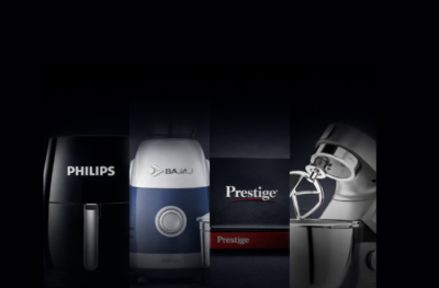 Kitchen appliances including Philips air fryer, Bajaj mixer, and Prestige cookware in dark premium background