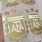 Gold AFA shield logo stickers with star detailing