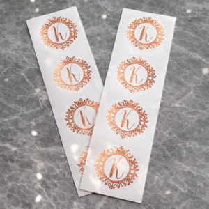 Custom logo sticker strips with rose gold circular branding
